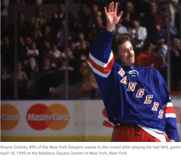 Wayne Gretzky waves to the crowd after playing his last NHL game